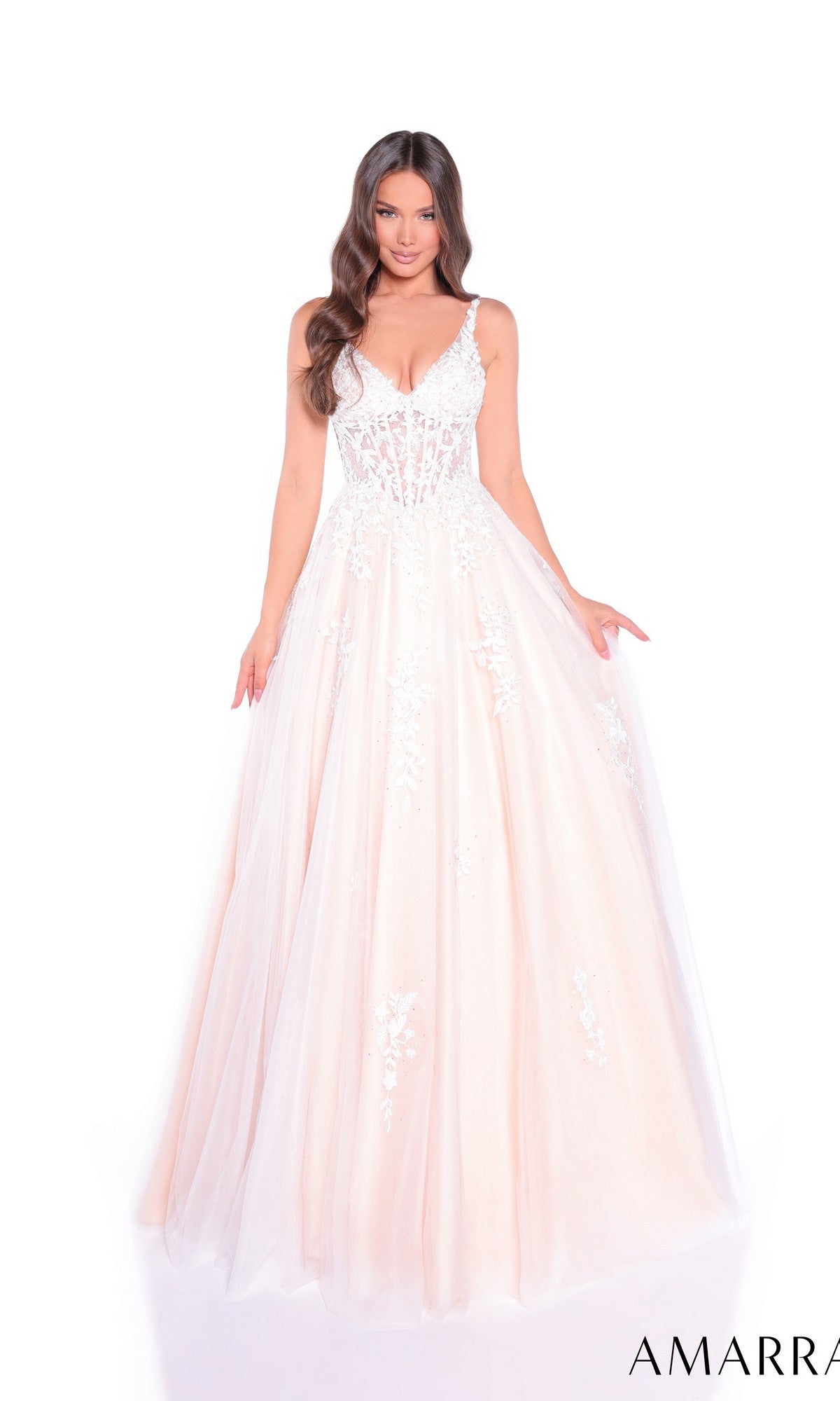 Woman wearing the Sheer-Waist Long A-Line Prom Dress Amarra 89523, a floor-length blush pink gown with a fitted bodice, sleeveless design, lace details, and floral embroidery, standing against a white background.